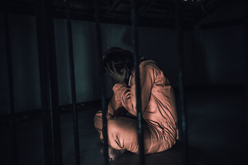 Portrait of women desperate to catch the iron prison,prisoner concept,thailand people,Hope to be...