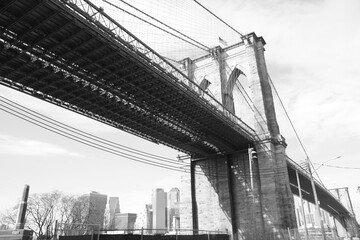 Fototapeta premium Famous Brooklyn Bridge in New York City, USA with beautiful blue sky, in black and white, monochrome, Manhattan, USA. 