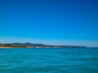 Blue water of Tyrrhenian sea in Vada, Tuscany, Italy.