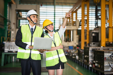 2 Happy factory inspector in warehouse. teamwork