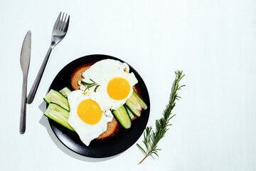 Fried eggs on the plate, healthy breakfast and proper nutrition