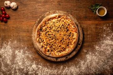 Top down pizza on wooden table for restaurant menu