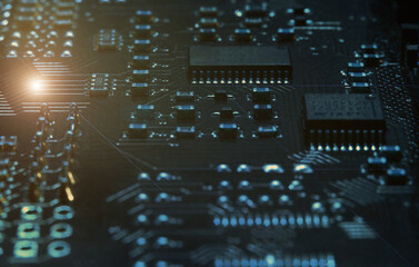 Fragment and components of a motherboard (PCB) of computer technology with many elements. Macro...