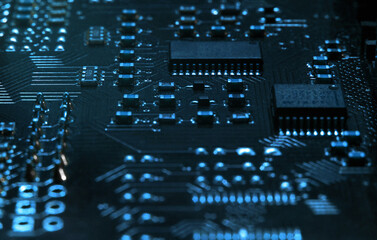 High-tech electronic board (PCB) with processor, microcircuits and luminous digital electronic signals. Close up macro photography - obrazy, fototapety, plakaty