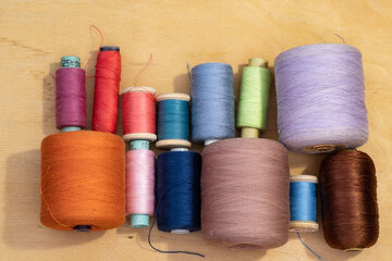 Fototapeta na wymiar Balls of thread for sewing various colors
