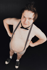 funny fat guy in suspenders and underpants with a bow tie