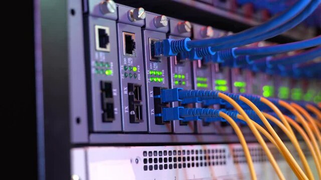 Fiber Optic cables connected to optic ports and UTP, Network cables connected to ethernet ports