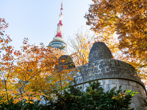 SEOUL, SOUTH KOREA, NOVEMBER 4, 2019: view of N Seoul Tower over Hanyangdoseong (Seoul City Wall) at Namsan Mountain in Seoul city in autumn. YTN Seoul Tower is communication and observation tower