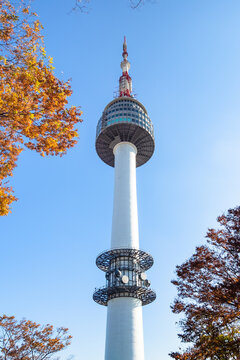 SEOUL, SOUTH KOREA, NOVEMBER 4, 2019: view of N Seoul Tower at Namsan Mountain with blue sky in Seoul city on sunny autumn day. YTN Seoul Tower is communication and observation tower