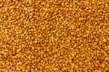 Raw buckwheat grains close up.