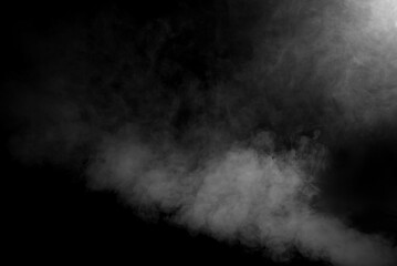 White smoke on a black background. The texture of scattered smoke. Blank for design. Layout for collages.