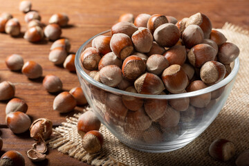Hazelnut with glass Cup close-up. Hazelnuts.