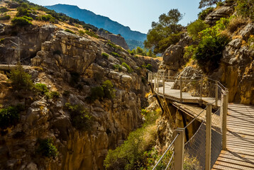 Fototapeta premium A close up view of the Caminito del Rey pathway suspended above the Gaitanejo river gorge near Ardales, Spain in the summertime