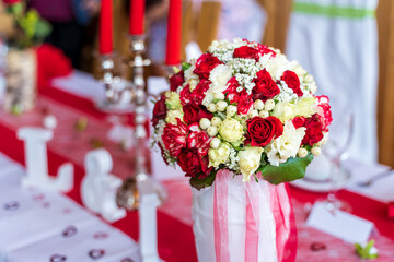 Red and White Wedding bouquet at Table - Close up