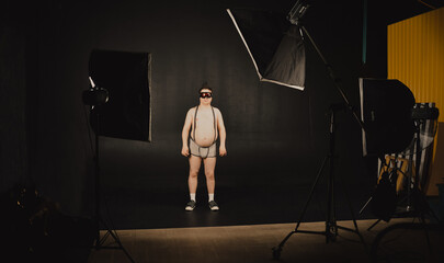 Cheerful guy in a ski mask posing in front of the camera