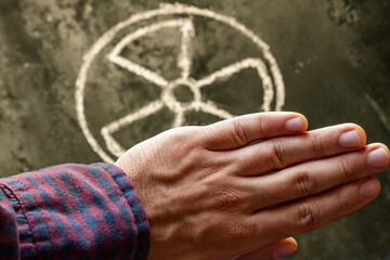 hand and nuclear weapon symbol concept renounce nuclear weapon