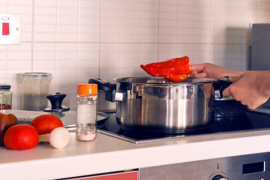 Stuffed peppers beeng cooked on kitchen stove