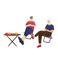 Dad and son are sitting at a table on a white background. Adults, family vacation concept.