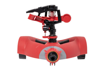 Garden watering system. Closeup of a automatic sprinkler for irrigation of lawn or grass isolated on a white background. Irrigation of the garden is important for the bloom and beauty of a garden. Mac