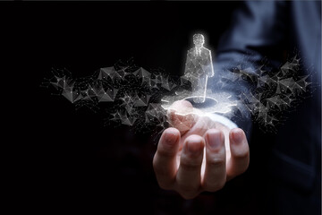 A businessman's hand shows a hologram of an employee on a gear .