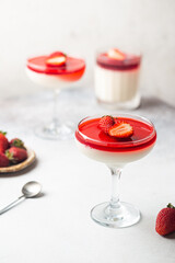 Italian panna cotta dessert with strawberry sirup and mint leaf