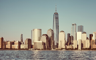 Manhattan skyline with cloudless sky at sunset, color toning applied, New York City, USA.