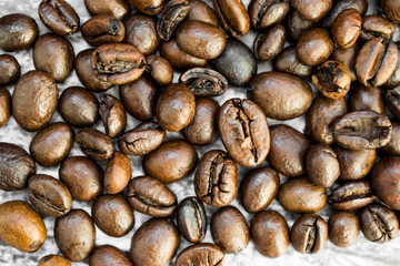 Roasted coffee beans close up. Top view. Coffee concept