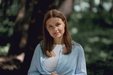 Portrait of a young beautiful girl with clean skin. Looks into the camera.