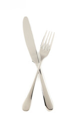 Fork and knife isolated on white background. Top view