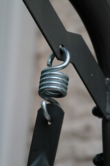 Metal spring close up. Metal spring for swing. Metal springs automotive parts close-up. 