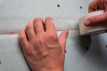 Gipskartonplatten Rigips mit Gewebeband Klebeband verkleben