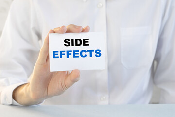 Doctor holding a card with text Side effects medical concept