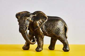 Fototapeta premium Studio shot of antique metallic elephant figurines on a black background