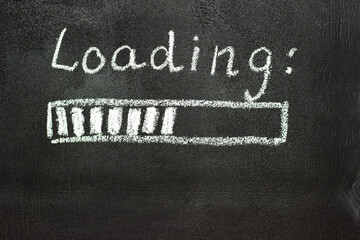 The loading process is shown in white on a chalkboard. Stop motion animation.