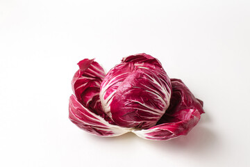 Fresh radicchio lettuce leaves on a white background. Isolate