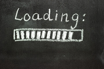 The loading process is shown in white on a chalkboard. Stop motion animation.