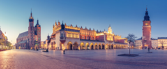 Krakow, Poland, main square night panorama with Cloth Hall and St Mary's church - obrazy, fototapety, plakaty