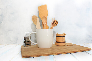 Kitchen wooden spoons for sugar, spices, honey, plate in white cup