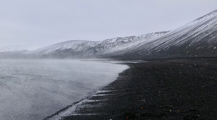 Antarctica, deception island, water crate, volcanic black stone, snow storm