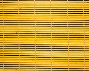 Sushi mat as background, texture. Yellow sushi mat.