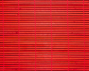 Sushi mat as background, texture. Red sushi mat.