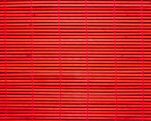 Sushi mat as background, texture. Red sushi mat.