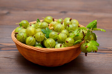 basket with fresh gooseberries on the table close-up