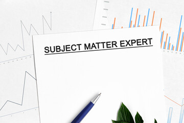 SUBJECT MATTER EXPERT document with graphs, diagrams and blue pen