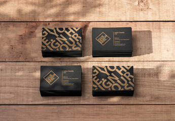 Four Stacks of Business Cards Mockup on Wooden Table