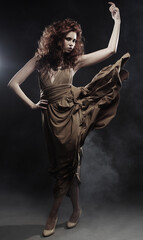 young woman in beige long dress