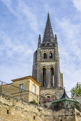 Fototapeta na wymiar XII century Monolithic Church (Eglise Monolithe) with 68-meter bell tower in the center of town Saint Emilion. Monolithic Church - largest underground church in Europe. Saint Emilion, Gironde, France.