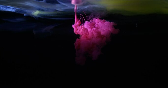 Red / Purple ink / paint shooting in water cloud tank with high speed camera