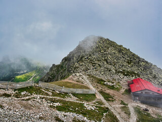 Fog Drifting Around the Rocky Summit of Chopok and Kamienna Chalet in the Low Tatras, Slovakia © Rastislav