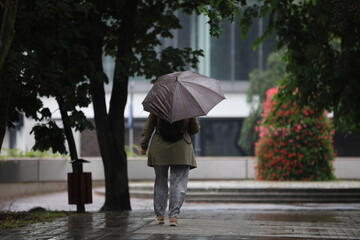 woman walking in rain